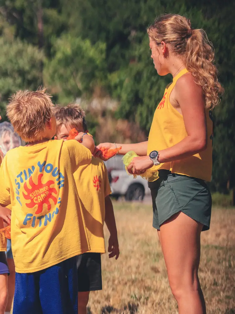 Camp counselor with kids at Austin Youth Fitness summer camp